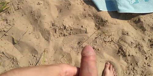 Jerked cock and came on a woman sunbathing on a wild beach