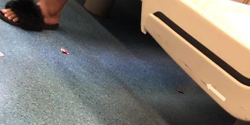 candid ebony dangling slides on the train