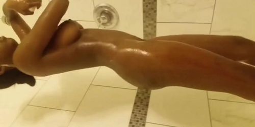 Ebony slut in the shower and butt plug