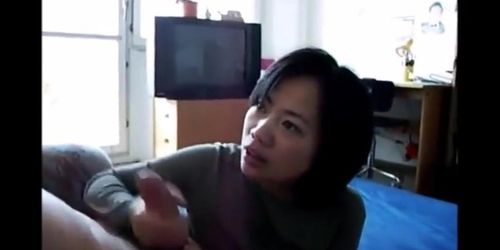 Mature Asian Strokes a Cock