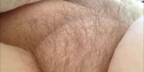 Teasing his wife's pubic hair