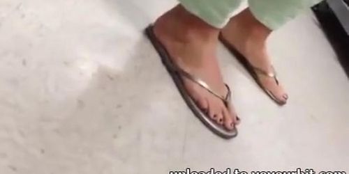Candid feet painted toes in Flip Flops