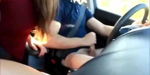 Sexy girl giving her guy a blowjob while he drives