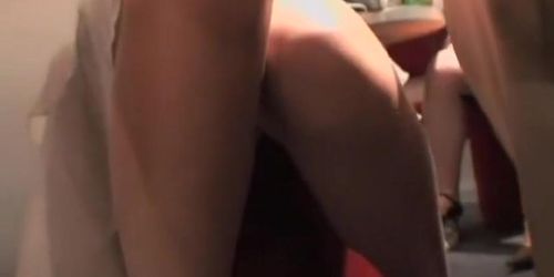 Hot Asian chicks provide upskirt shots in a crowded bar