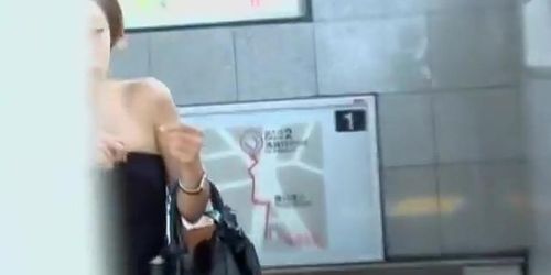 Stylish Asian darling flashes her boobies when her top gets pulled down