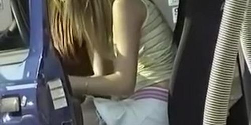 Panties view as she bends in the car