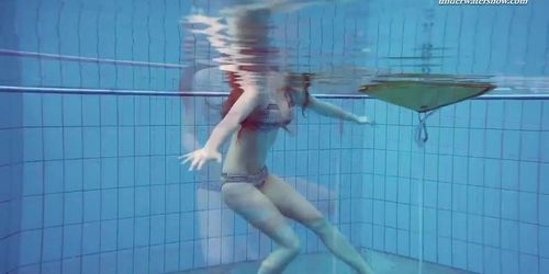 Big boobs teenie Liza Bubarek swimming naked in the pool