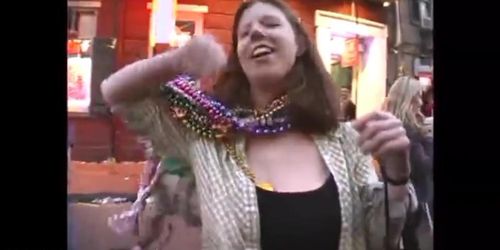 Beautiful redhead Milf showing off her fabulous breasts mardi gras