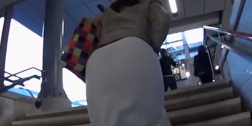 Black thong seen thru milf's skirt