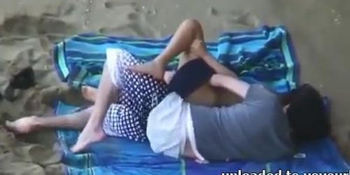 Beach candid camera shows slut having sex