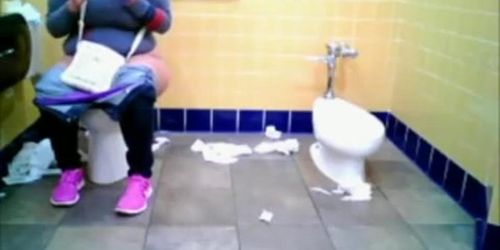 Chubby woman spied in public toilet peeing