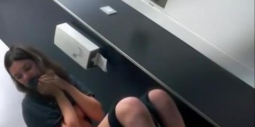 Brunette girl pulling down her bikini bottom and pissing