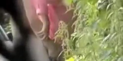 Voyeur camera spying couple having sex in the bushes