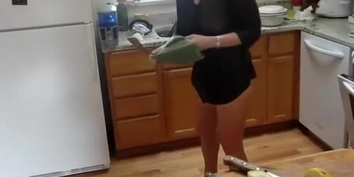 Mature lady spied while baking muffins