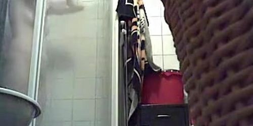 Bathroom spy cam records a blonde pissing and then showering