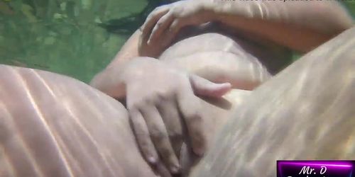 Public masturbation outdoors. Submersible camera records a young horny girl playing with her big pussy in the river completely n