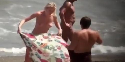 Nudist blonde woman caught in nudist beach