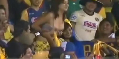 Sexy soccer fan flashes fans by accident