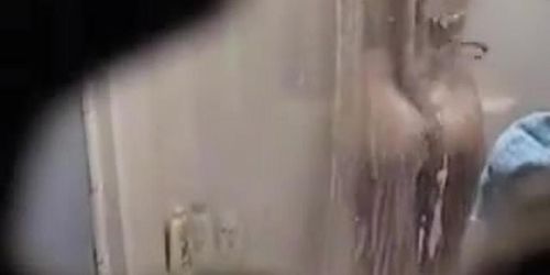 Spy shower cam gets mature girl showering