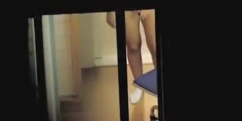 Amateur providing us with real window voyeur fun