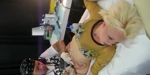 Blonde bimbo moans with pain as her pubis was being tattooed