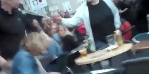 Drunk woman pissing on a bar terrace