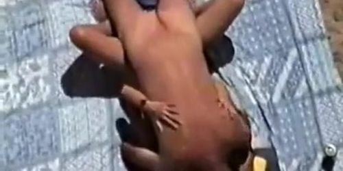 Voyeur cam films couple fucking on beach