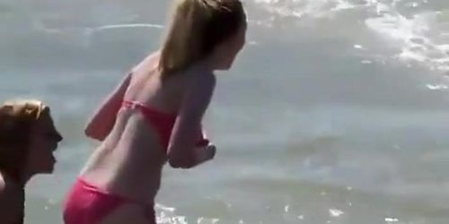 Big boobs teen in red bikini at beach