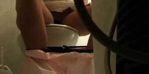 Peeing hidden cam captures girl emptying her bladder on the toilet