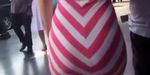 Big ass woman in tight white and pink dress