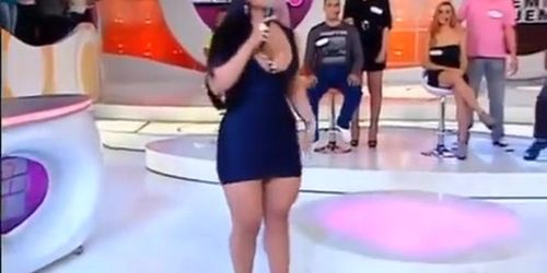 Chubby Latina in a tight dress sings on TV show