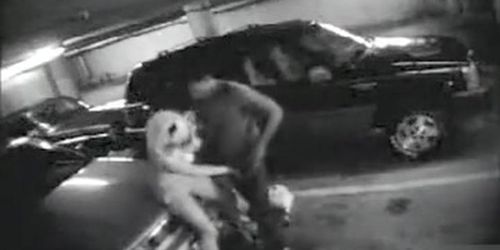 Parking garage sex on security camera with a charming blonde