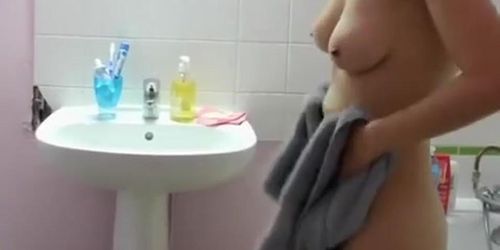 Woman secretly filmed by husband in bathroom