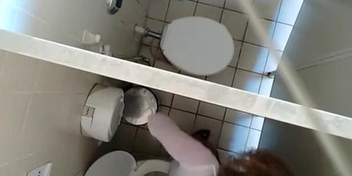 Hidden camera in public toilet ceiling