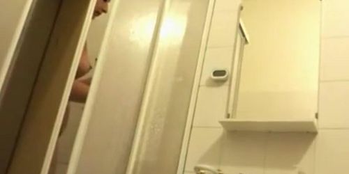 Teen taking shower in bathroom