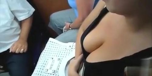 Big boobs in a tank top on a busy train