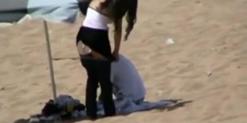 Couple spied in the beach fucking under the sun umbrella