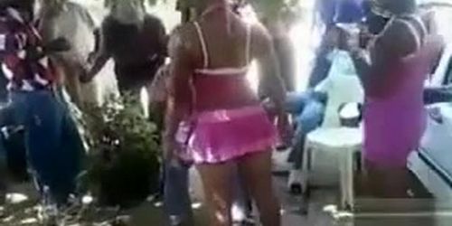 Black prostitute gives a naughty public lap dance