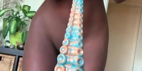 Black slut rides her tentacle.