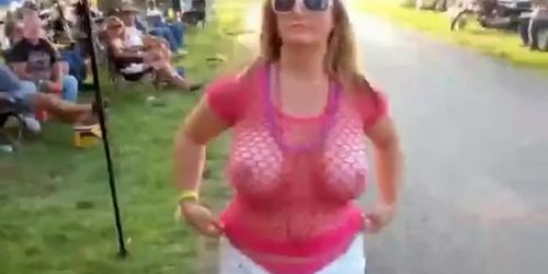 Big boobs biker girl flashes at the park