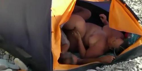 Fat woman fucked in the beach tent