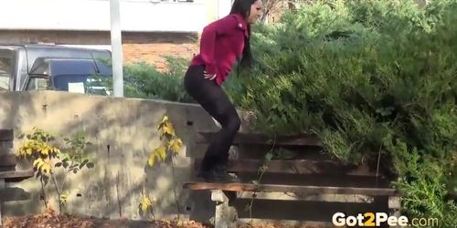 Brunette Hottie Takes Huge Long Piss On Bench In Public