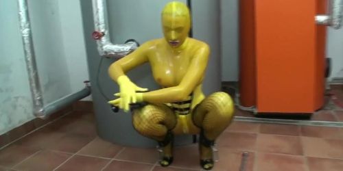 Girl Full Encased In Yellow Latex Catsuit + Fishnets Makes Self Bondage