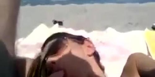 Sandra blowing bf on the beach