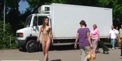 Naked cutie has fun in public streets