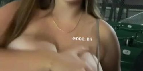 Girl flashes huge boobs at game