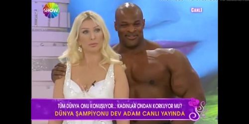 Sexy Blonde Turkish anchor with Big Man on TV Show