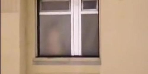 Window voyeur girl staying naked back to my shooting device