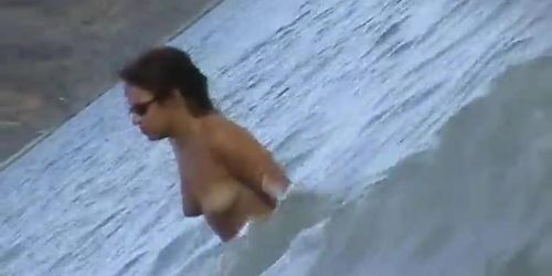 Nude beach voyeur scenes with amateurs bathing in the sea