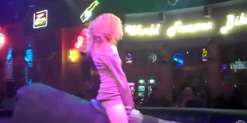 Riding the mechanical bull uncovers blonde's sexy ass